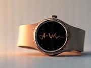 Side view of a minimalist silver fitness watch showing heart rate tracking.